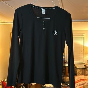 CALVIN KLEIN black soft ribbed long sleeve tee-shirt. 3 snap front closure. S/P